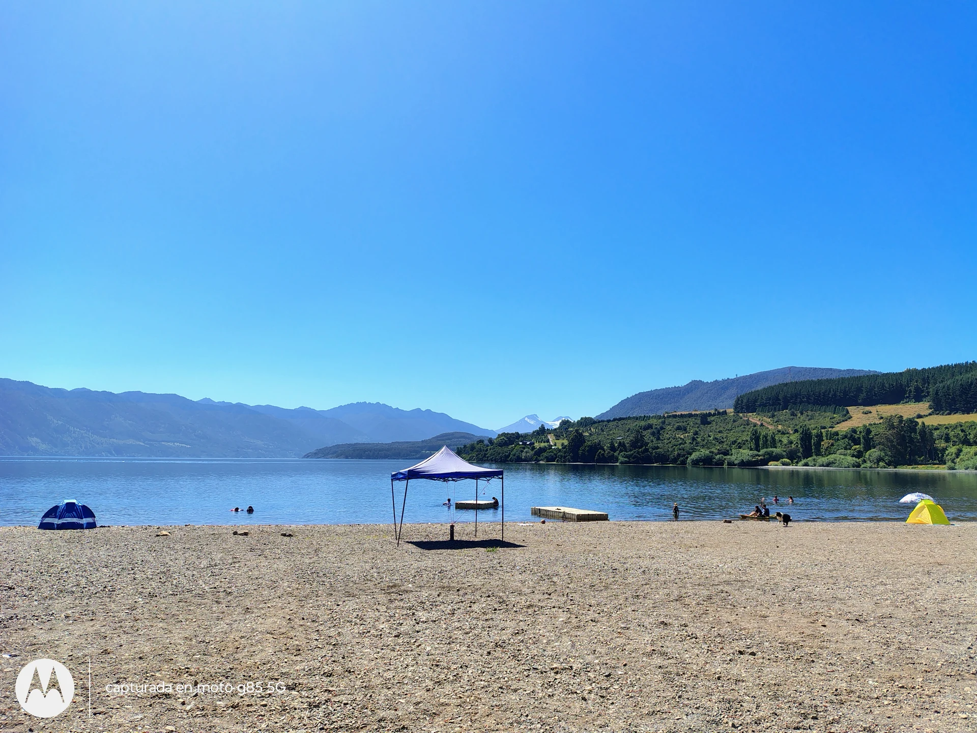 Public beach and clear waters of Lake Riñihue